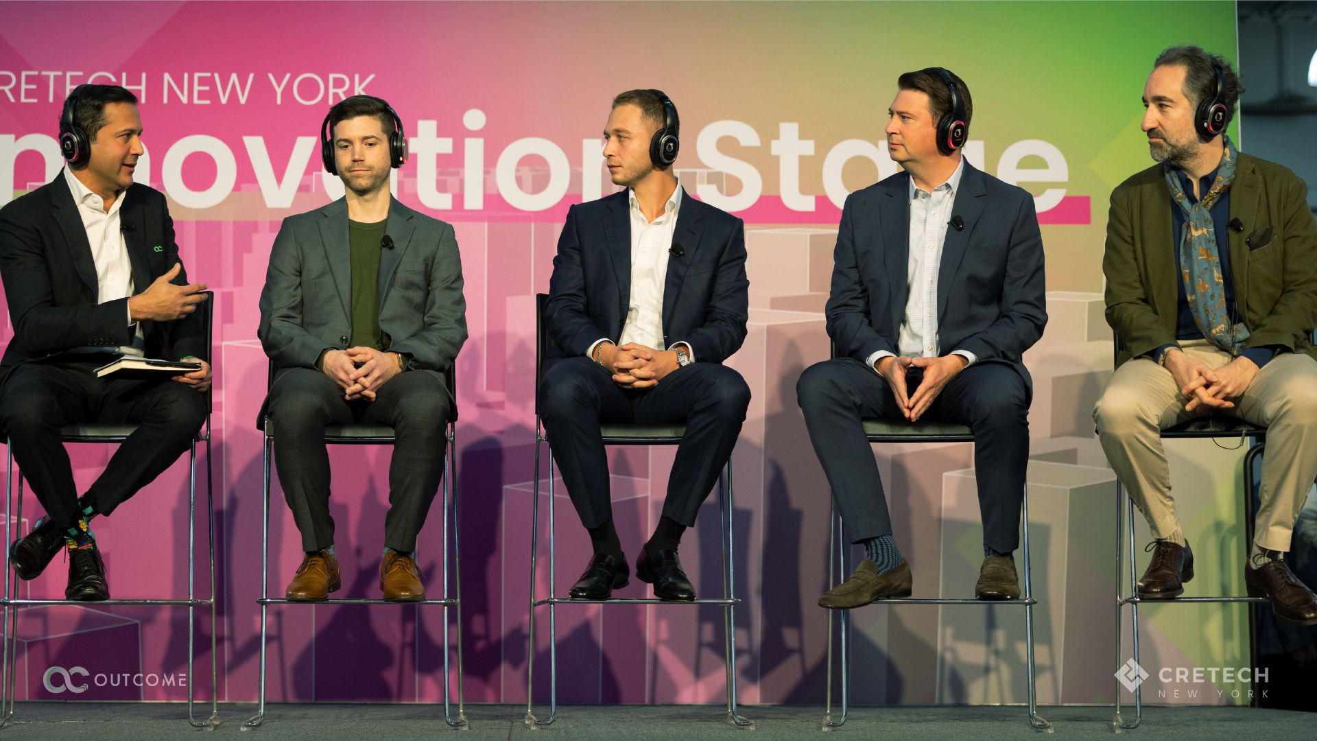 5 panelist sitting on stage talking